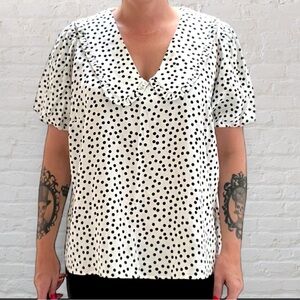 Polka dot blouse with ruffled Peter Pan collar